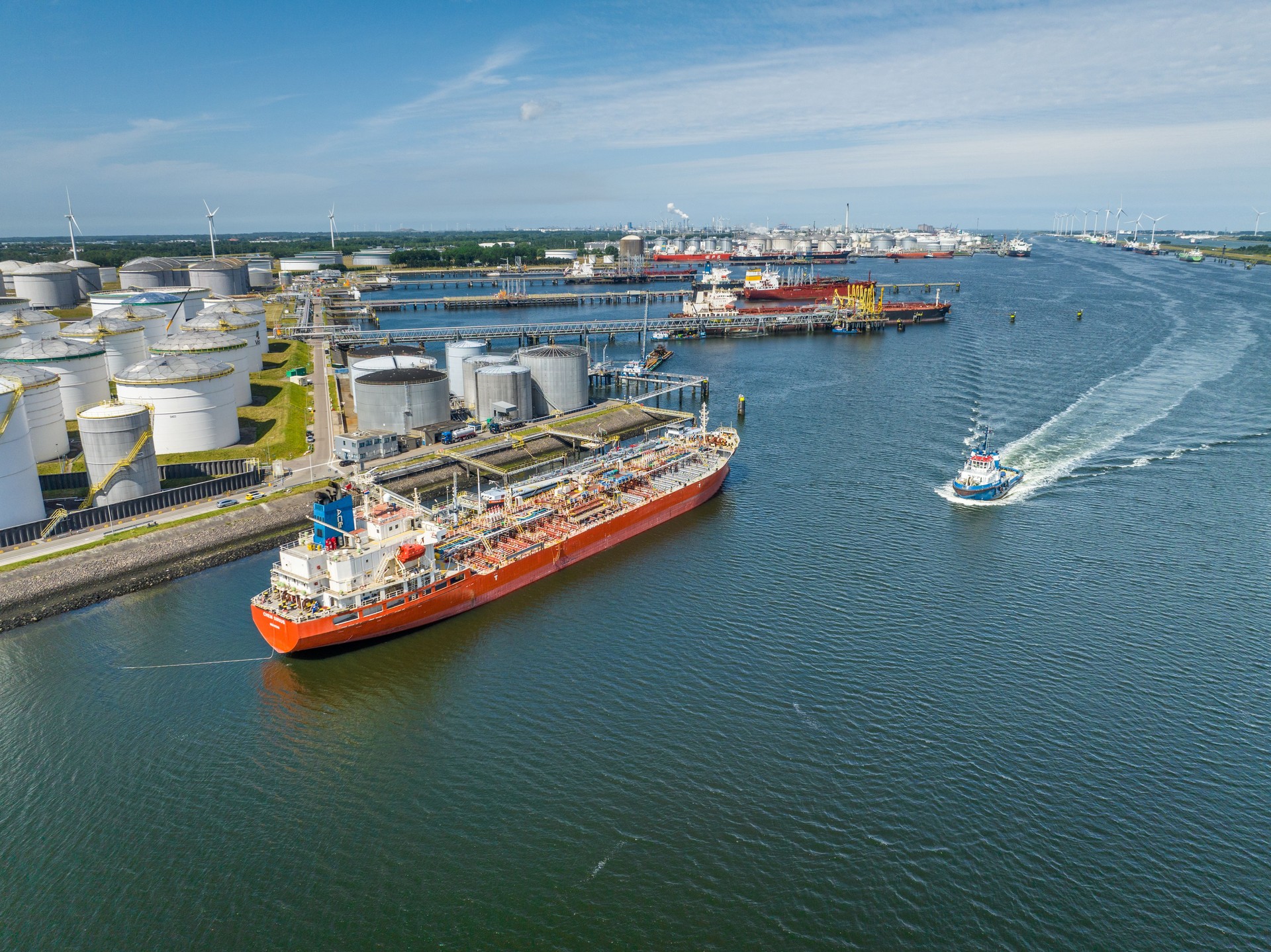 Crude Oil Liquid Cargo Transporter Ship Unloading Petrochemicals to a Fuel Depot