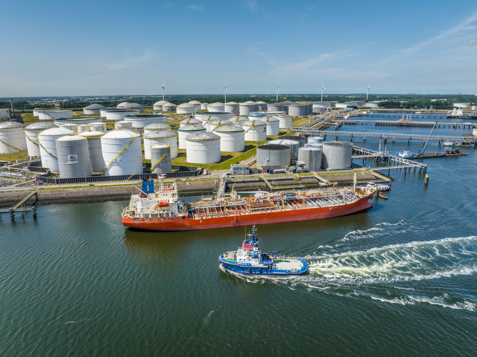 Crude Oil Liquid Cargo Transporter Ship Unloading Petrochemicals to a Fuel Depot